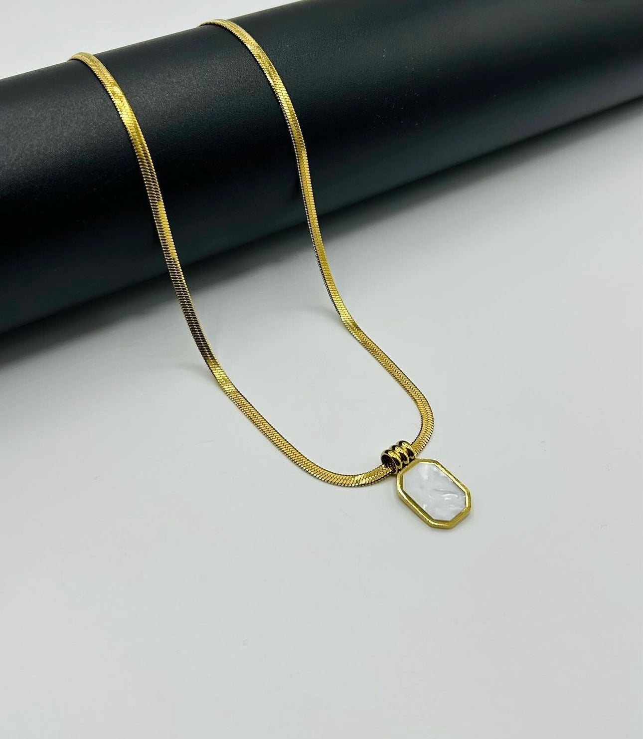 White pendant golden chain